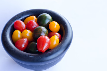 Tomatoes in group on white background
