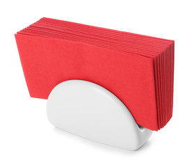 Ceramic napkin holder with paper serviettes on white background