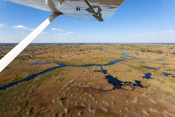 scenic flight above botswana with small bush plane at okavango delta