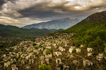 Fototapeta na wymiar Kayakoy houses in historcial Lycian village of Kayakoy, Fethiye, Mugla, Turkey. Panoramic Ghost Town Kayaköy, anciently known as Lebessos and Lebessus. 3000 Greek life in the 19th century.