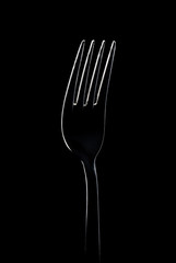 fork on black background