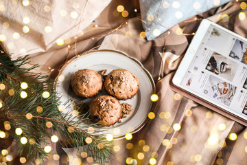 Delicious fresh cupcakes with walnut on a plate in bed. 