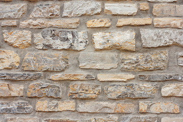 Old weathered brick wall of medieval fortress, horizontal grunge background