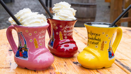 Traditional Christmas beverage - Eggnog, also known as milk punch or egg milk punch, in cup in the...