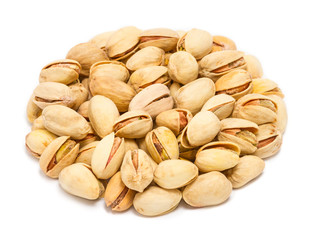 Fototapeta premium Handful of pistachio nuts (Pistacia vera) in the shell, close up, isolated on white background