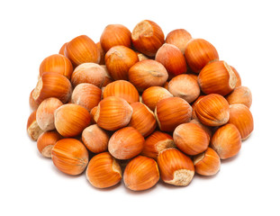 Handful of ripe hazelnuts in the shell close up, isolated on white background