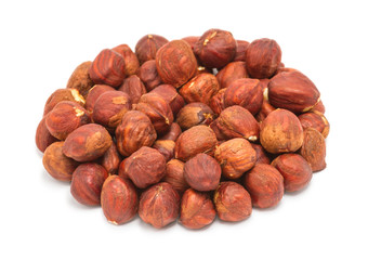 Handful of peeled ripe hazelnuts closeup, isolated on white background