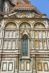 Fototapeta na wymiar Closeup view of the details of Cathedral of Santa Maria in Florence, Italy on a sunny day.