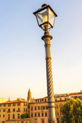 Fototapeta na wymiar A streetlight lamp with historic buildings in the background in Venice, Italy.