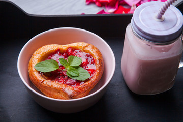 Tray with cake and smoothie and a gift