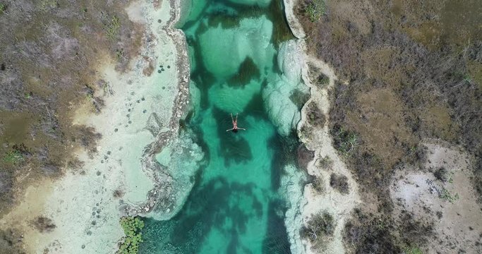 Woman swimming in Bacalar