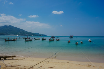 Fototapeta na wymiar Boats on the coast of the tropical island of Phuket. Thailand