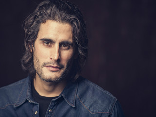 Portrait of confident man in studio in a serious pose 