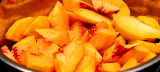 A bowl of fresh sliced peaches.