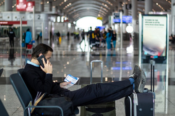 Passenger talking on the phone at the airport