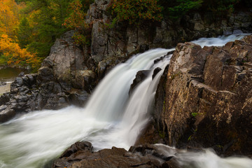 Naklejka na ściany i meble Side view of Split Rock Falls during Autumn in the Adirondacks New York