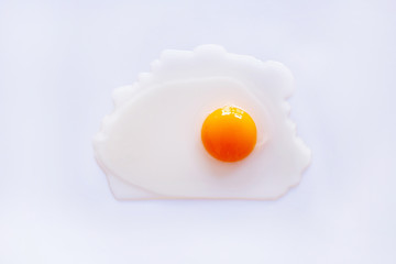 Raw egg yolk on white