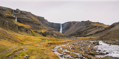 Panoramic photos of famous Icelandic waterfalls on cloudy days with geological formations. © Road Red Runner