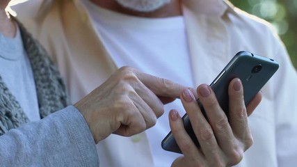 Grandparents using smartphone, available tariffs, online pharmacy app order