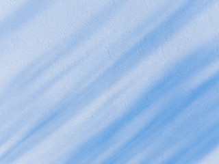 Obraz premium Aerial view on the texture of snow with shadow from trees on the surface of a winter lake 