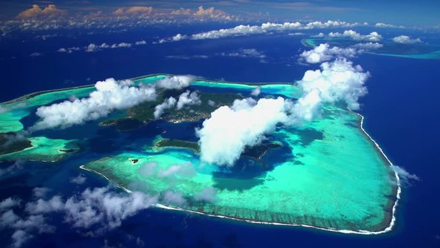 Aerial view of the lagoon and coral reef of Bora Bora and Tahaa 