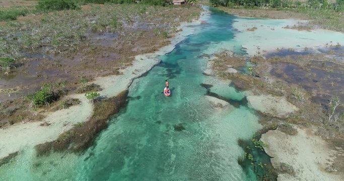Man paddling in Bacalar