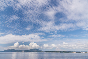 Corfu Island Greece and clouds over it.