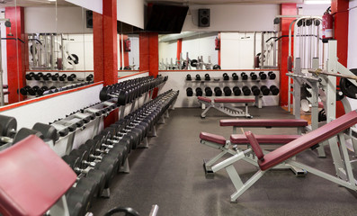 Fototapeta na wymiar Weight training equipment in gym club