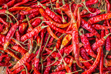 Dried red hot chilli pepper closeup background