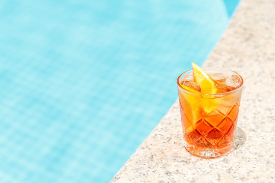 Negroni Cocktail  Near A Pool At The Resort Bar Or Suite Patio. Luxury Resort, Vacation, Room Service Concept