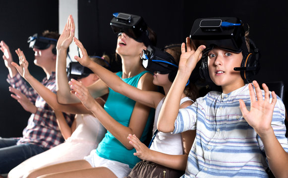 Boy is fascinated by movie in virtual reality glasses