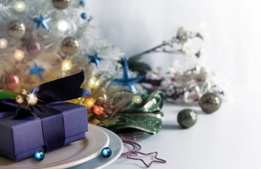 Abstract of Christmas Background. Navy Blue Christmas Giftbox and Christmas Tableware Concept  for Composition with Celebration Copy Space.