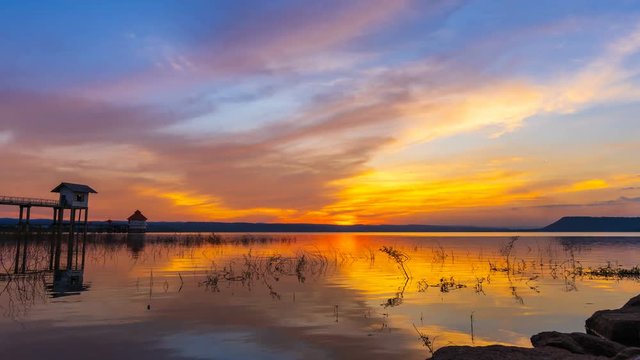 Day to night time lapse of sunset at Lum Chae dam, Khonburi, Nakhon Ratchasima, Thailand