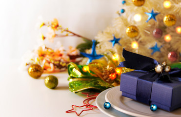 Abstract of Christmas Background. Navy Blue Christmas Giftbox and Christmas Tableware Concept for Composition with Celebration Copy Space.
