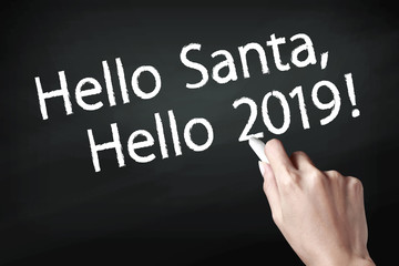 Hand writing hello santa and hello 2019.