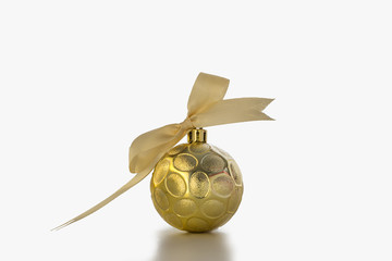 Christmas ornament golden ball with ribbon on white background