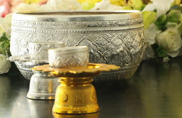 Bathing rite for Buddha images and the monks.