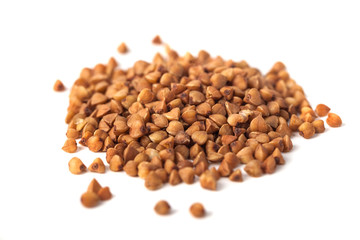 Buckwheat grain isolated on white background, healthy wood