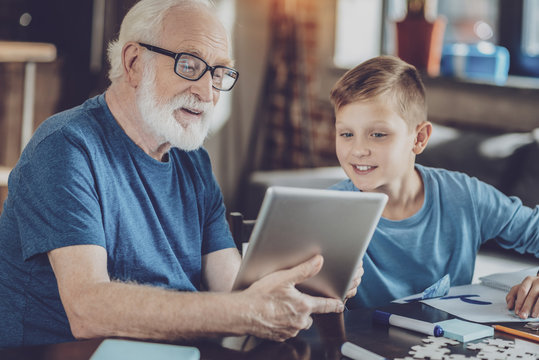Positive delighted pensioner spending time with grandson