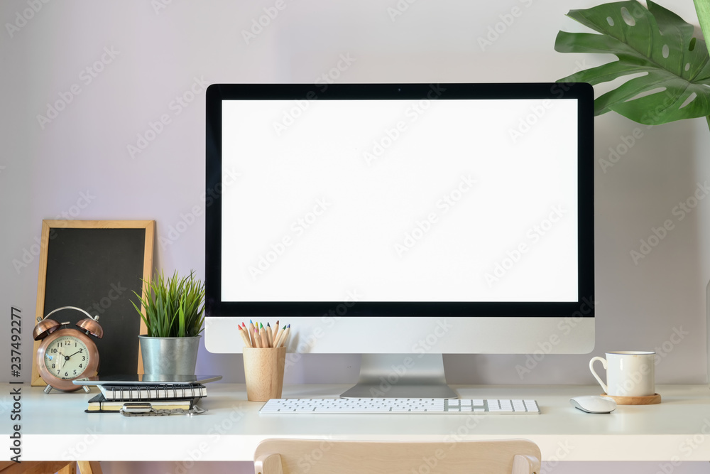 Poster mockup modern blank screen desktop computer on stylish workspace.