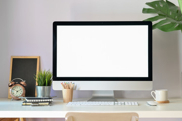 Mockup modern blank screen desktop computer on stylish workspace.