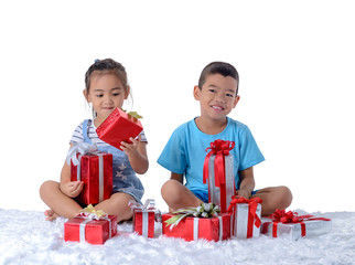 portrait of happy little asian boy and girl with Many gift boxes isolated on white background