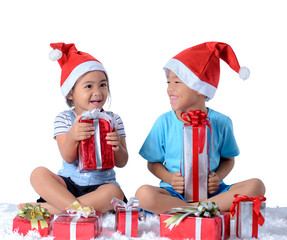 portrait of happy little asian boy and girl with Many gift boxes isolated on white background