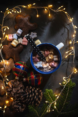 Cup of milk and Marshmallow. Christmas lights