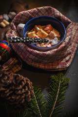 Cup of milk and Marshmallow. Christmas lights