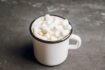 Sweet hot chocolate in mug. Christmas drink with marshmallow. Selective focus. Shallow depth of field. 