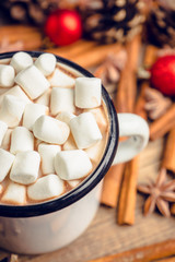 Sweet hot chocolate in mug. Christmas drink with marshmallow. Selective focus. Shallow depth of field. 