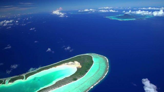Aerial view Tupai Heart Island a coconut plantation Island in the South Pacific 