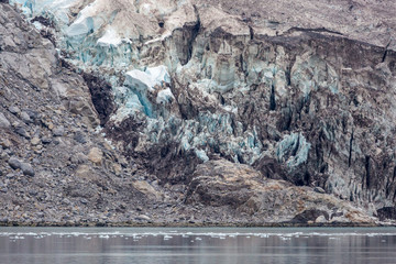 A glacier with blue ice in Kenai Fjords National Park in Alaska. 