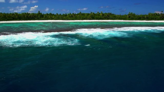 Aerial view of Tupai Heart Island coral reef atoll in French Polynesia